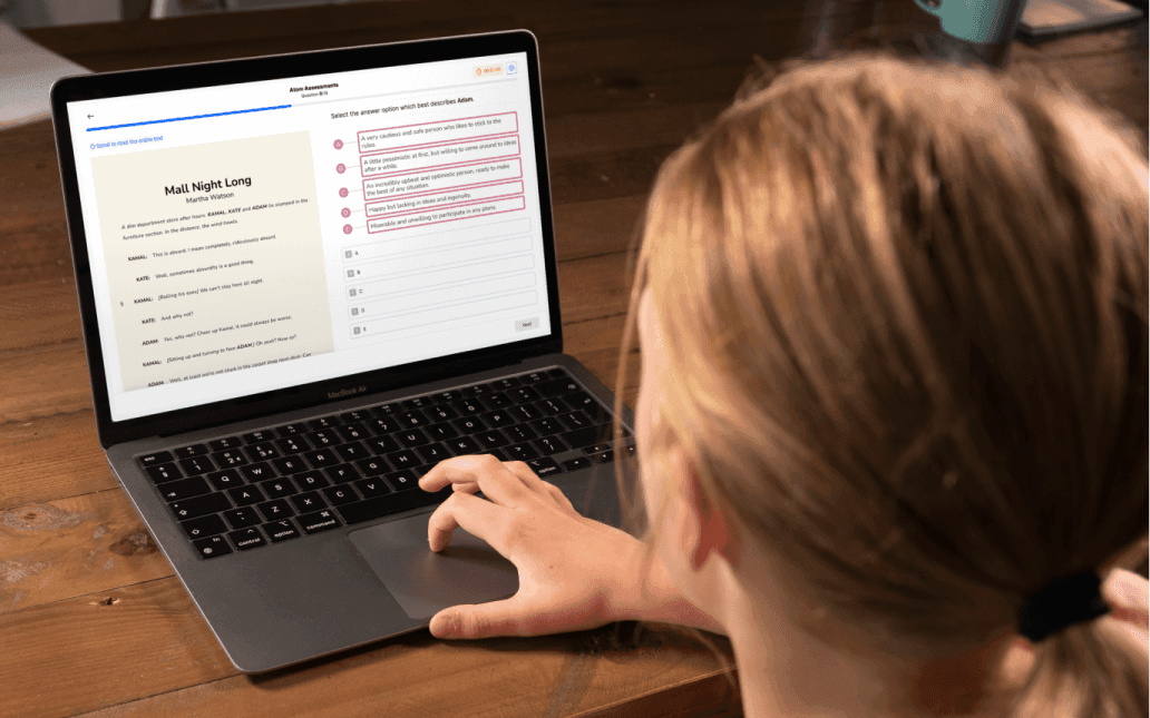 Child taking an Atom Assessments test on a laptop