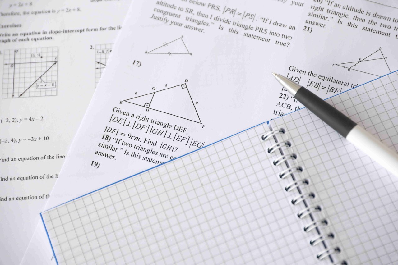 Example GCSE practice paper, with a notebook and pen